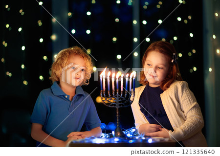 Kids celebrating Hanukkah. Festival of lights. 121335640