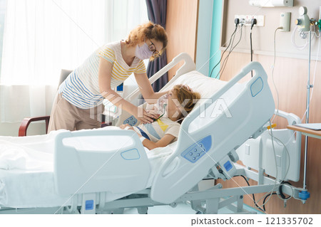 Sick child in hospital room. Kid in clinic ward. 121335702