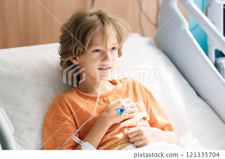 Sick child in hospital room. Kid in clinic ward. Sick child in hospital room. Kid in clinic ward. 121335704