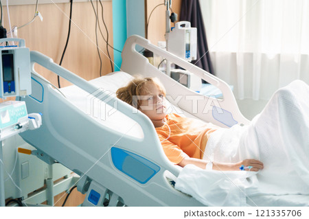 Sick child in hospital room. Kid in clinic ward. 121335706