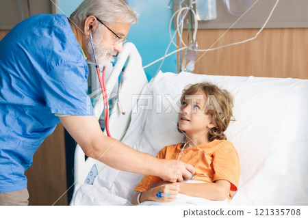Sick child in hospital room. Kid in clinic ward. 121335708