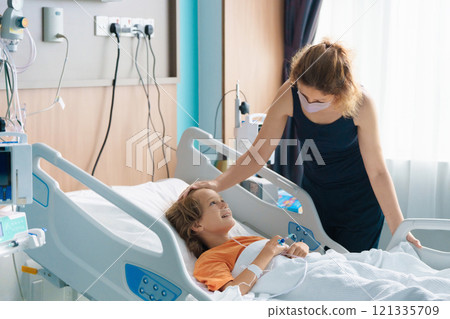 Sick child in hospital room. Kid in clinic ward. 121335709