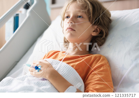 Sick child in hospital room. Kid in clinic ward. Sick child in hospital room. Kid in clinic ward. 121335717