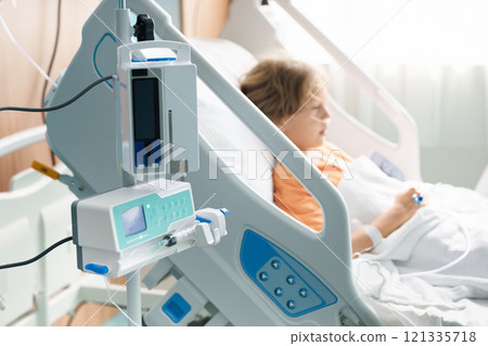 Sick child in hospital room. Kid in clinic ward. 121335718