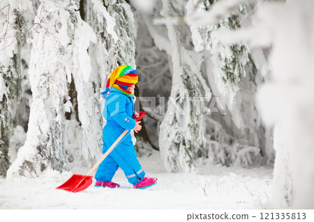 Kids play in snow in winter park Kids play in snow in winter park 121335813