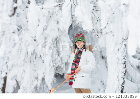 Kids play in snow in winter park 121335859