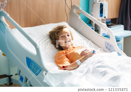 Sick child in hospital room. Kid in clinic ward. Sick child in hospital room. Kid in clinic ward. 121335871
