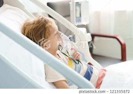 Sick child in hospital room. Kid in clinic ward. 121335872