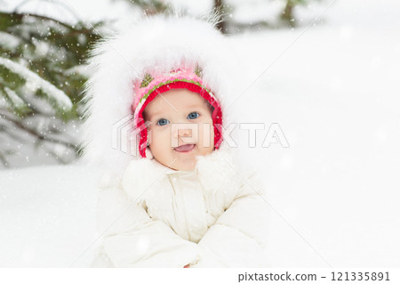 Kids play in snow in winter park Kids play in snow in winter park 121335891
