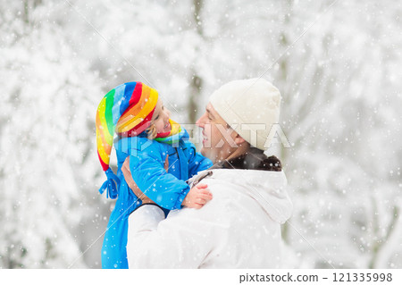 Kids play in snow in winter park Kids play in snow in winter park 121335998