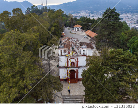 Aerial Drone shot of Church Iglesia de San Cristobalito on the mountain in San Cristobal de Las Casas, Chiapas, Mexico Aerial Drone shot of Church Iglesia de San Cristobalito on the mountain in San Cristobal de Las Casas, Chiapas, Mexico 121336028