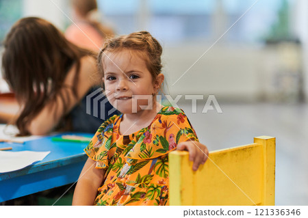 Creative kids sitting in a preschool institution, draw and have fun while they get an education Creative kids sitting in a preschool institution, draw and have fun while they get an education 121336346