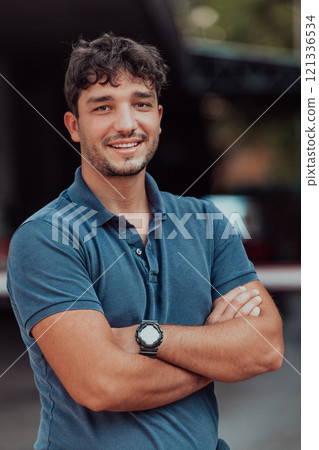 Portrait of a young successful entrepreneur in front of the company Portrait of a young successful entrepreneur in front of the company 121336534