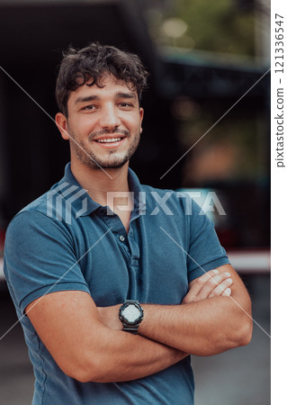 Portrait of a young successful entrepreneur in front of the company Portrait of a young successful entrepreneur in front of the company 121336547