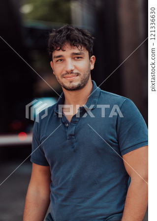 A portrait of a modern man, exuding confidence and style, against an outdoor backdrop, showcasing his charisma and fashionable demeanor. 121336630