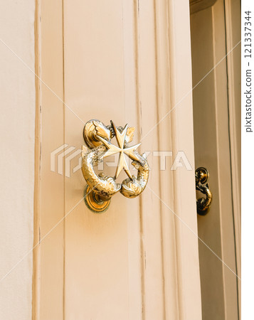 Traditional door handle with a Maltese cross Traditional door handle with a Maltese cross 121337344