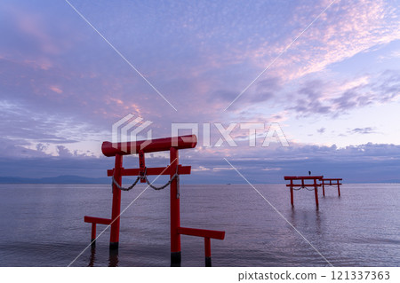Tara Town, Saga Prefecture - A torii gate standing in the shallow waters of the Ariake Sea in the autumn morning Tara Town, Saga Prefecture - A torii gate standing in the shallow waters of the Ariake Sea in the autumn morning 121337363