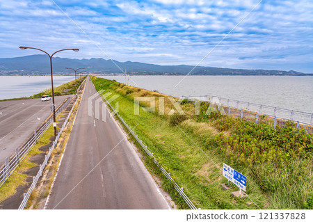 Isahaya City, Nagasaki Prefecture - View of Unzen from the Unzen-Tara Sea Line running over Isahaya Bay in the Ariake Sea 121337828