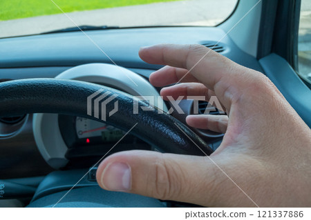 Right hand gripping the handle Right hand gripping the handle 121337886