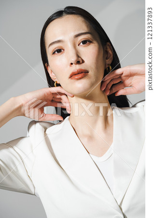 Portrait of a career woman in a white suit Portrait of a career woman in a white suit 121337893