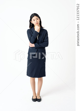 A young career woman in a suit is worried 121337912