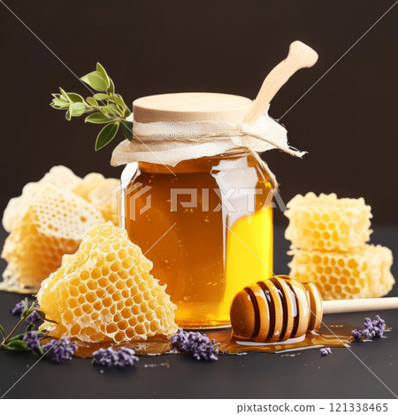 jar of natural organic honey with wooden dipper and honeycombs, surrounded by lavender and greenery, creating rustic and wholesome food background jar of natural organic honey with wooden dipper and honeycombs, surrounded by lavender and greenery, creating rustic and wholesome food background 121338465