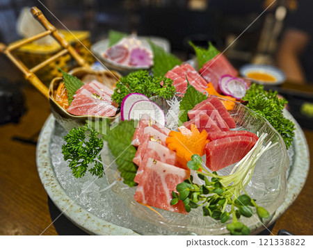 A tray of sushi with a variety of meats and vegetables A tray of sushi with a variety of meats and vegetables 121338822