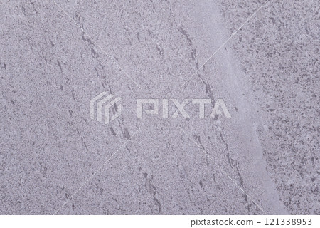 A grey stone wall with a white stripe A grey stone wall with a white stripe 121338953