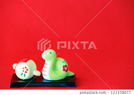 Image of a magic mallet and the New Year's celebrations for the Year of the Snake Image of a magic mallet and the New Year's celebrations for the Year of the Snake 121339077