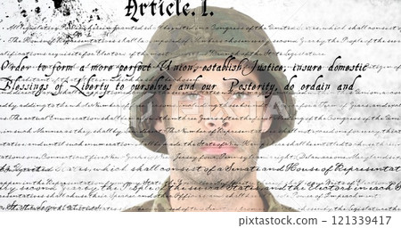 Saluting soldier over United States Constitution text image 121339417