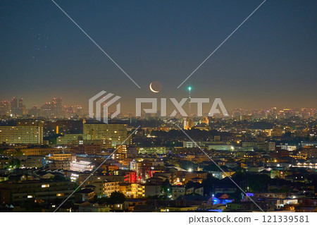 View of the waning crescent moon and the Pleiades in Taurus rising towards Komae City, Tokyo, and the center of the city from Tama Ward, Kawasaki City, Kanagawa Prefecture View of the waning crescent moon and the Pleiades in Taurus rising towards Komae City, Tokyo, and the center of the city from Tama Ward, Kawasaki City, Kanagawa Prefecture 121339581