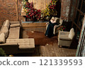 young girl christmas holiday celebration woman fireplace tree home alone cozy new year 121339593
