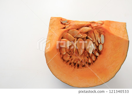 Cut pumpkin on white background 121340533