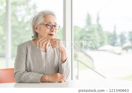 Thinking about something, confused, worried, troubled senior, elderly woman (active senior) Thinking about something, confused, worried, troubled senior, elderly woman (active senior) 121340663