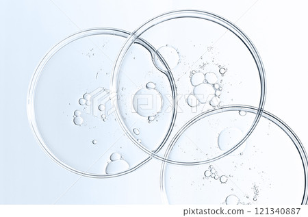 The texture of a cosmetic serum or body gel in a Petri dish. The texture of a cosmetic serum or body gel in a Petri dish. 121340887