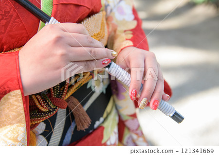 Hands of a woman in a kimono 121341669