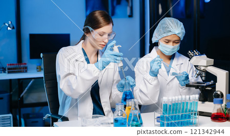 Scientist two woman with tablet and laptop, laboratory and ecofriendly science. Agriculture, research and scientists with online reading, test samples Scientist two woman with tablet and laptop, laboratory and ecofriendly science. Agriculture, research and scientists with online reading, test samples 121342944