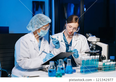 Scientist two woman with tablet and laptop, laboratory and ecofriendly science. Agriculture, research and scientists with online reading, test samples 121342977