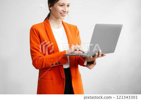 Portrait photo of young beautiful woman feeling happy and holding smart phone, tablet and laptop with black empty screen on white background can use for advertising or product presenting concept. 121343301