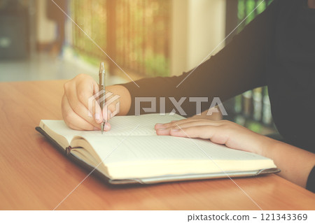 Girl writing a book 121343369