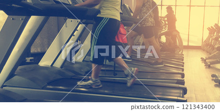 Cardio on electric treadmill machine. Cardio on electric treadmill machine. 121343400