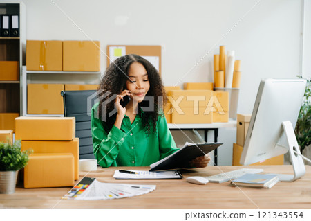 Startup small business SME, Entrepreneur owner woman using smartphone or tablet taking receive 121343554