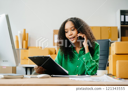 Startup small business SME, Entrepreneur owner woman using smartphone or tablet taking receive Startup small business SME, Entrepreneur owner woman using smartphone or tablet taking receive 121343555