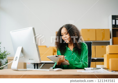 Startup small business SME, Entrepreneur owner woman using smartphone or tablet taking receive Startup small business SME, Entrepreneur owner woman using smartphone or tablet taking receive 121343581