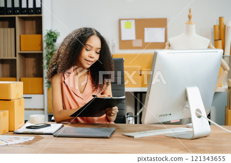 Small business entrepreneur SME freelance woman working at home office, BOX,tablet Small business entrepreneur SME freelance woman working at home office, BOX,tablet 121343655