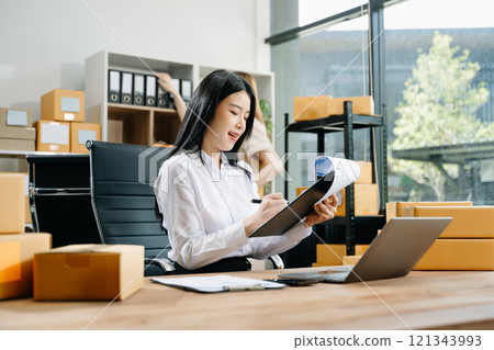 Starting small businesses SME owners, two check online orders Selling products working with boxs freelance work 121343993