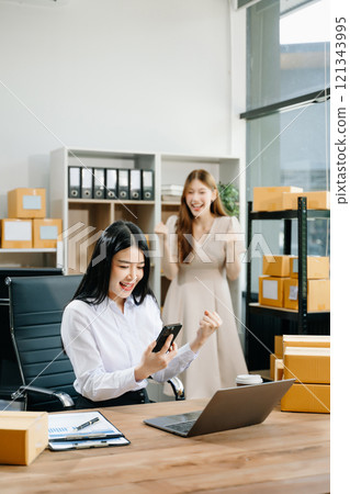 Starting small businesses SME owners, two check online orders Selling products working with boxs freelance work 121343995