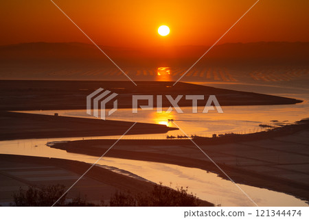 Shiota River flowing into the Ariake Sea and sunrise 121344474