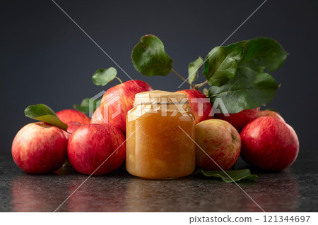 Apple jam and red fresh apples. 121344697