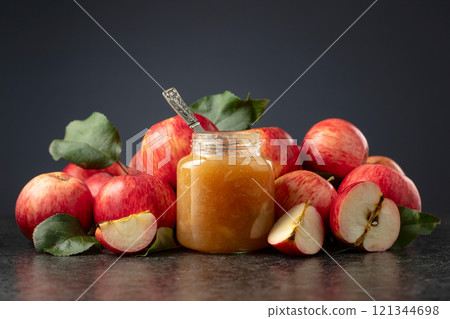 Apple jam and red fresh apples. 121344698